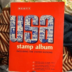 Soft-Covered Book Titled “USA Stamp Album including the United Nations”